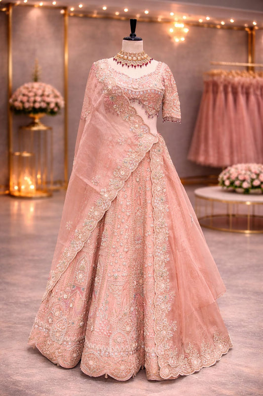 Dreamy Peach Bridal Lehenga with Intricate Zardozi & Pearl Embellishments