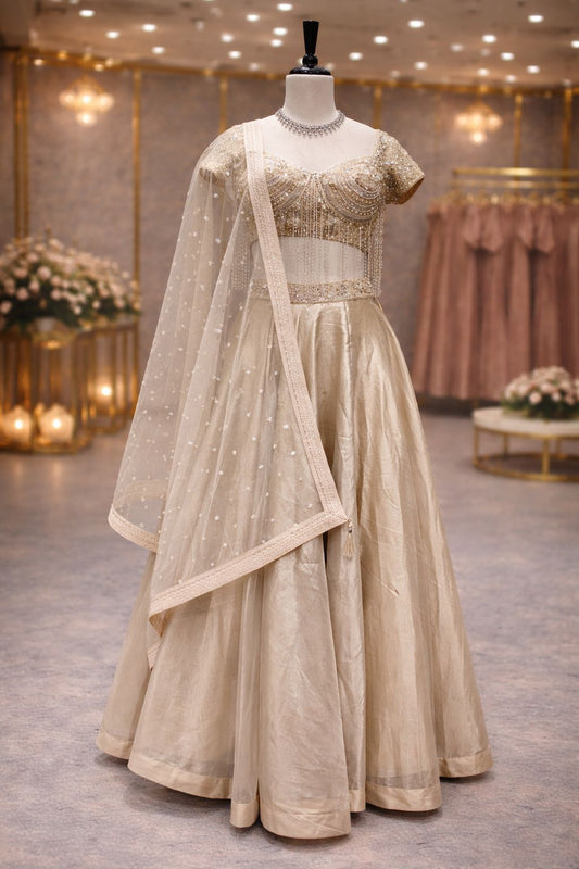 Champagne Beige Tissue Lehenga with Hand Kardana, Pearl & Emerald Stone Embellishment