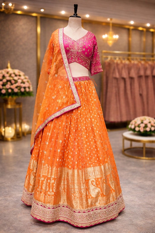 Rani & Orange Banarasi Lehenga with Handcrafted Kardana–Arri Blouse