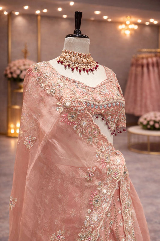 Dreamy Peach Bridal Lehenga with Intricate Zardozi & Pearl Embellishments