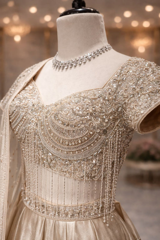 Champagne Beige Tissue Lehenga with Hand Kardana, Pearl & Emerald Stone Embellishment